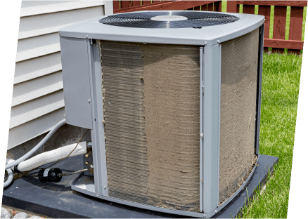 A heat pump displayed in front of a home.